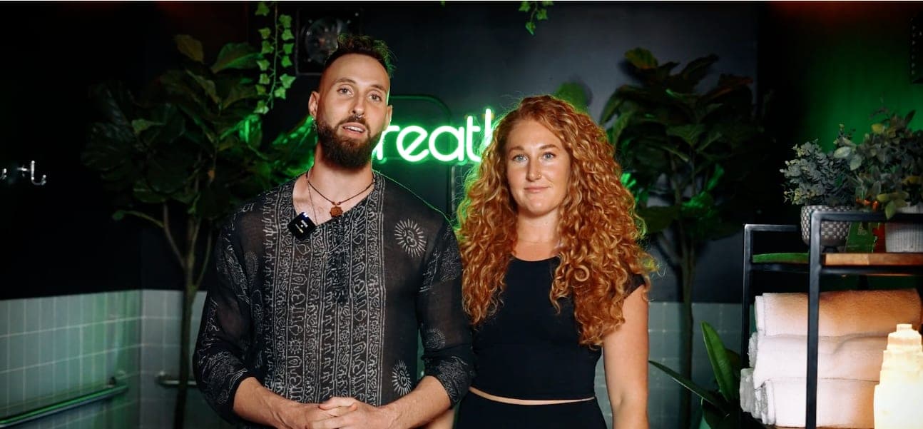 Co-founders Nathanael and Anna Rabbitt in front of the Breathe neon